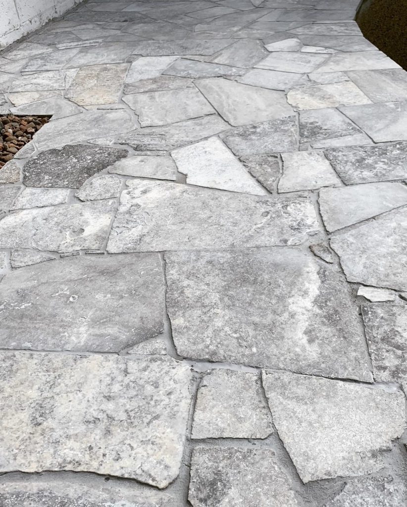Silver travertine crazy pave close-up texture