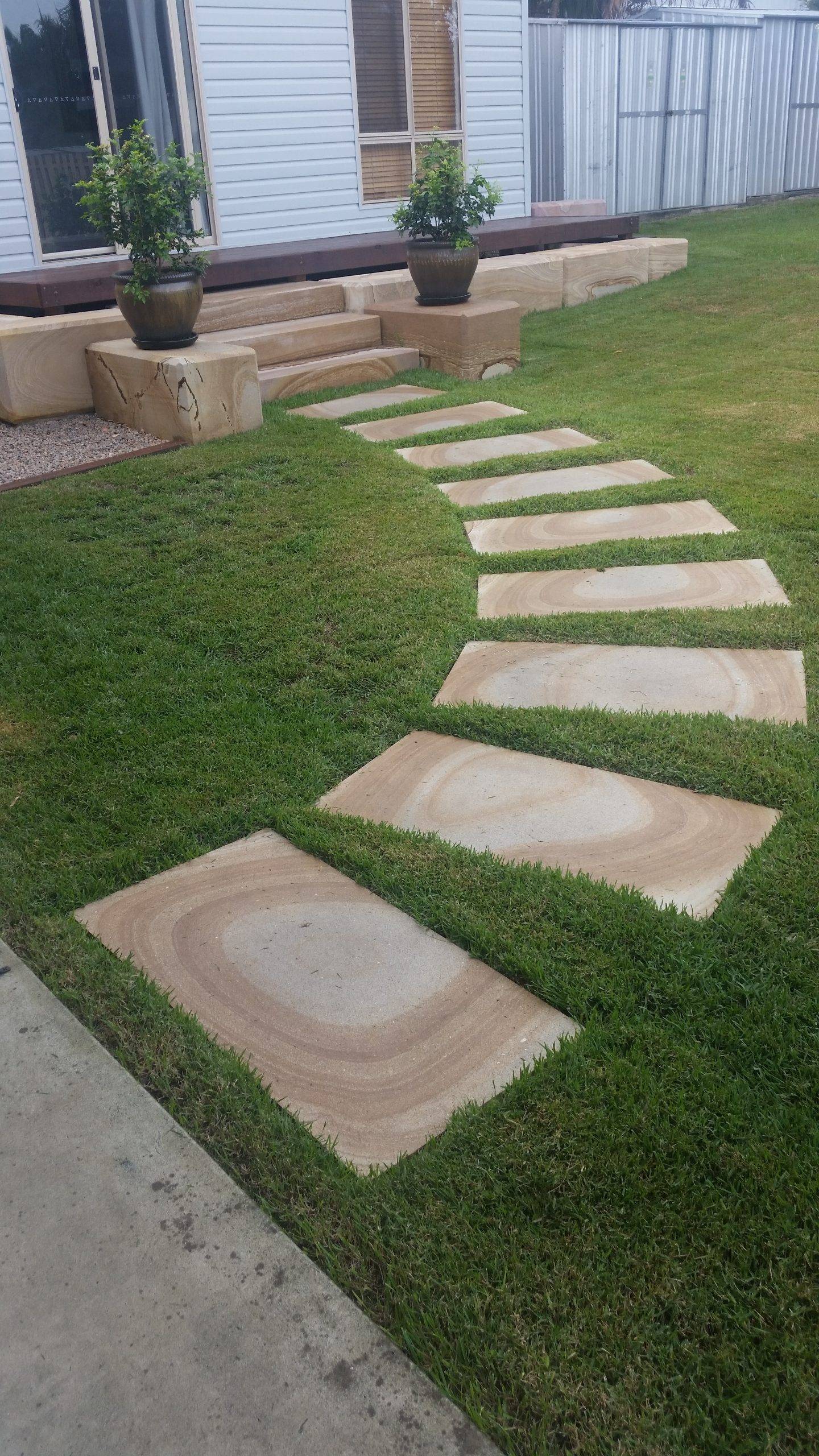 Sandstone stepping stones laid in garden pathway Gold Coast