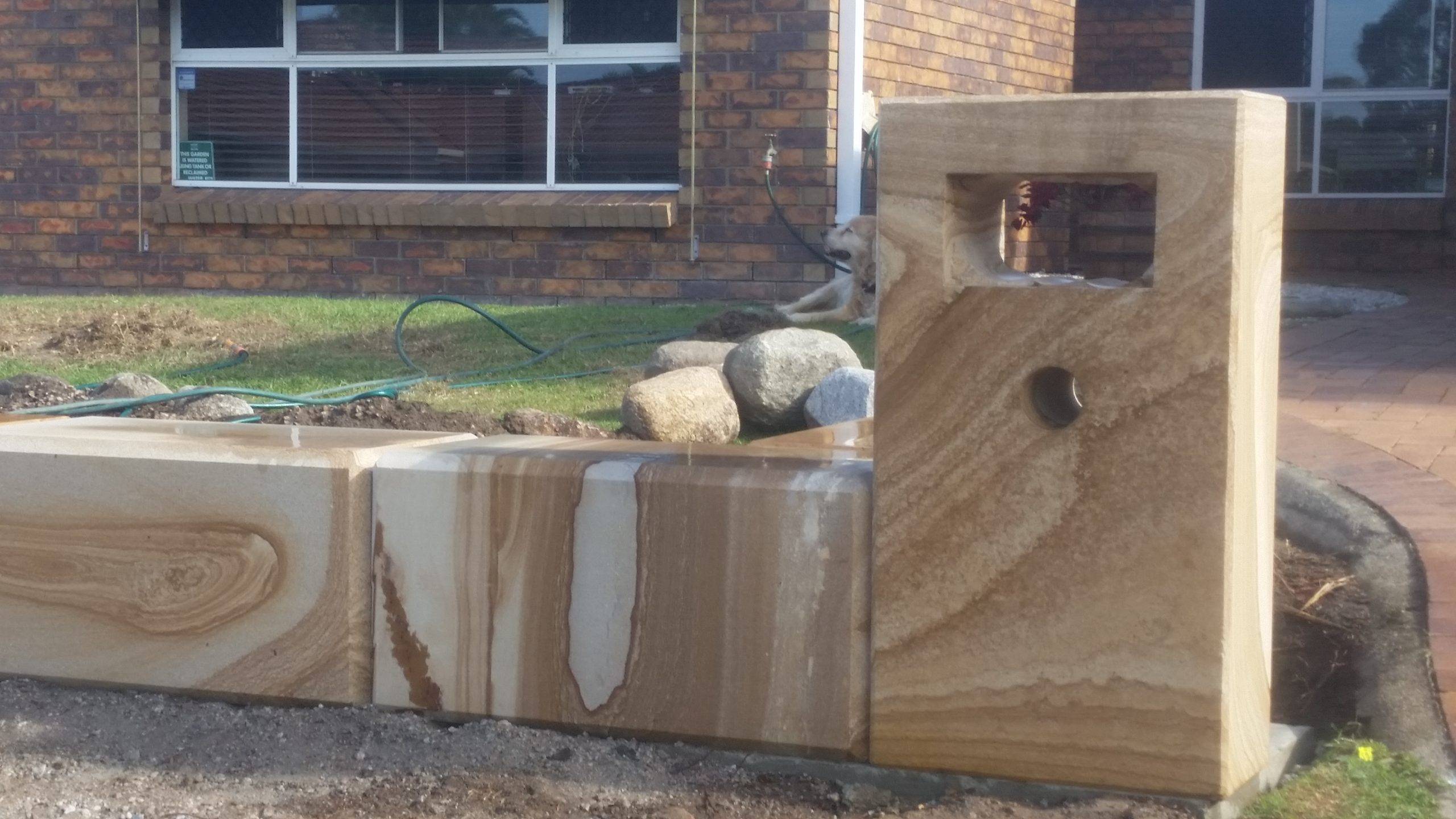 Formal sandstone letterbox front view showing engraved numbers