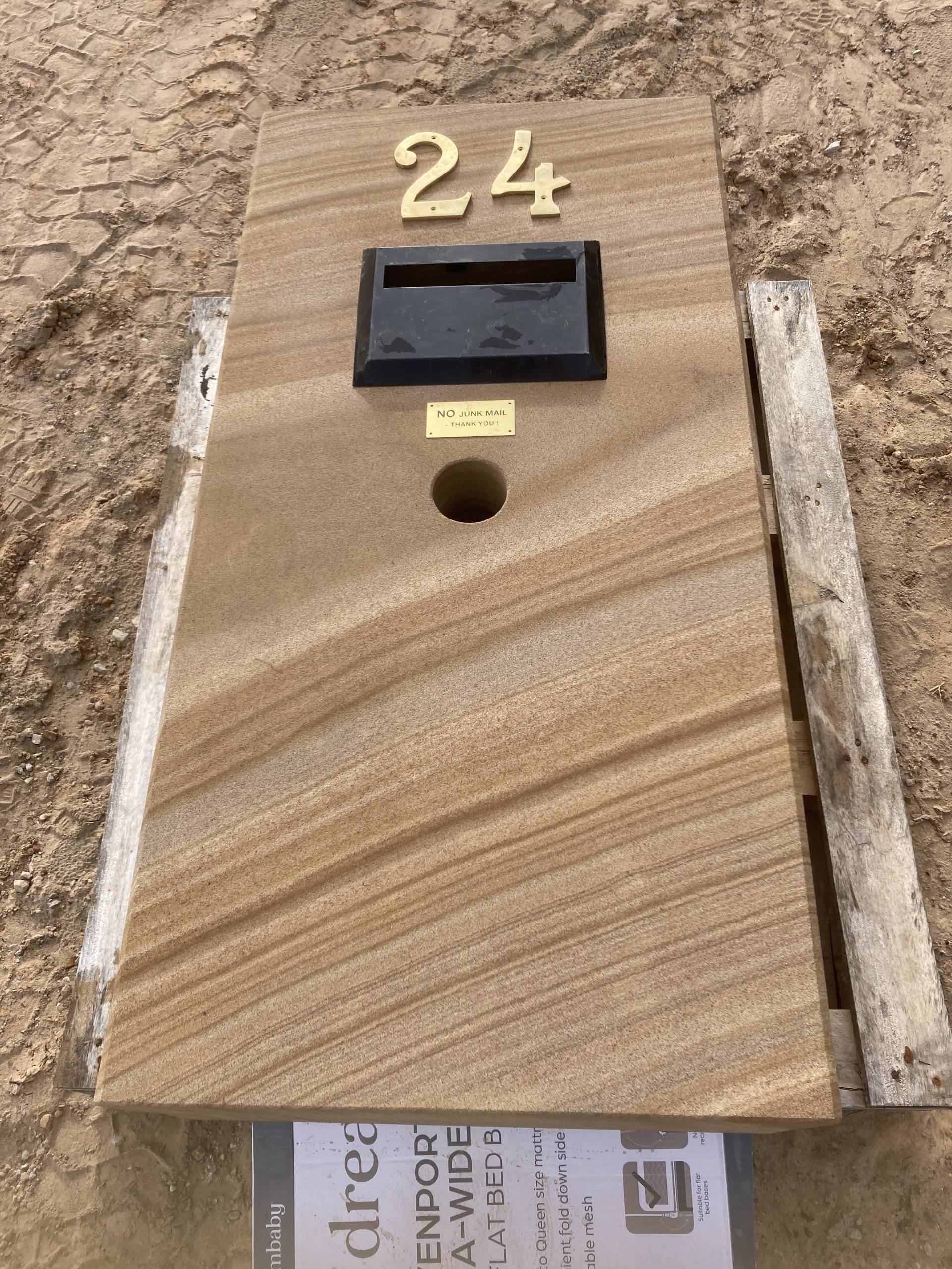 Formal sandstone letterbox installed at Brisbane residential property