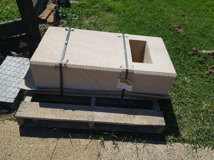 Formal sandstone letterbox detail showing quality stonework