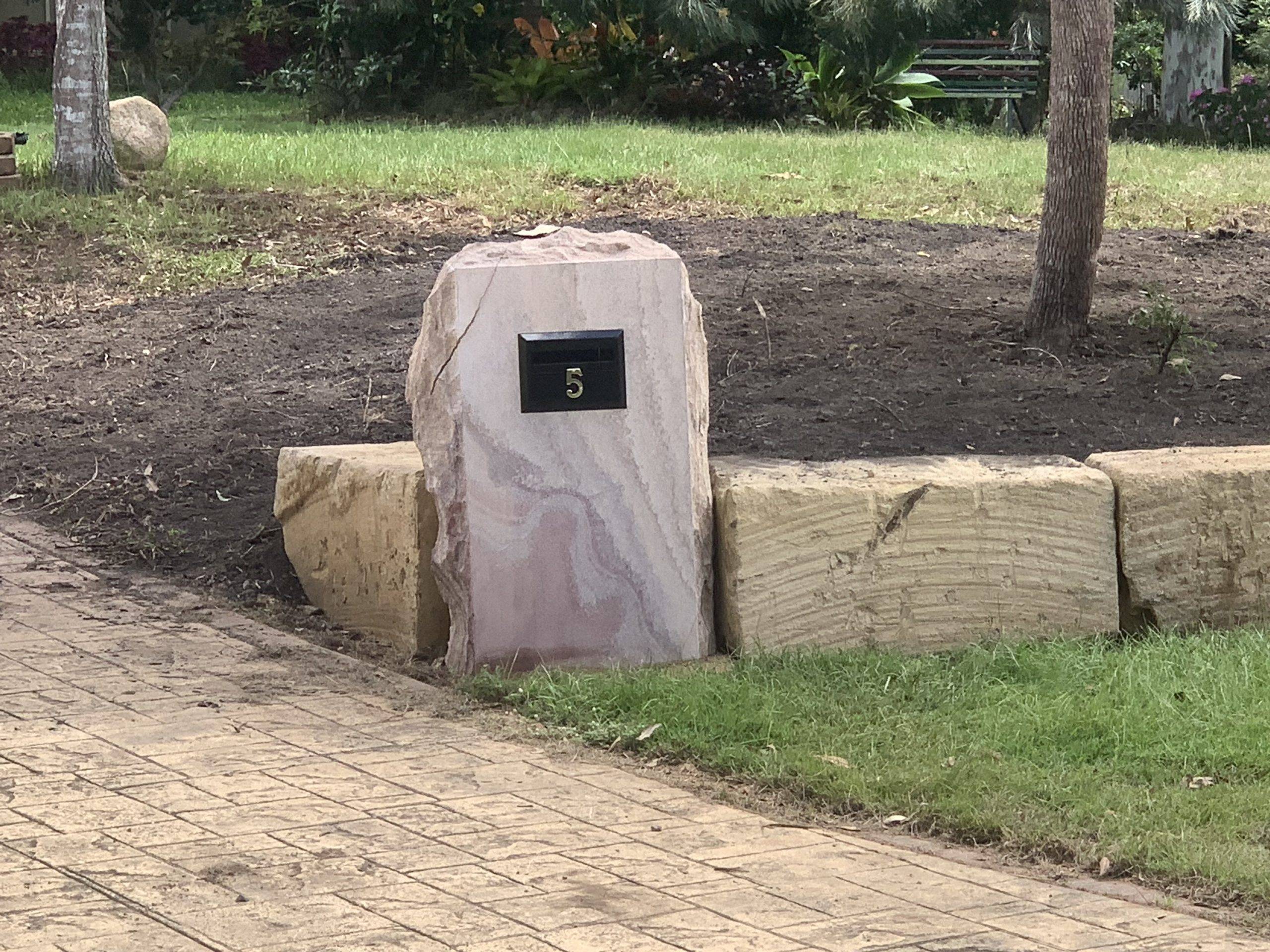 Rockfaced sandstone letterbox installed at residential property