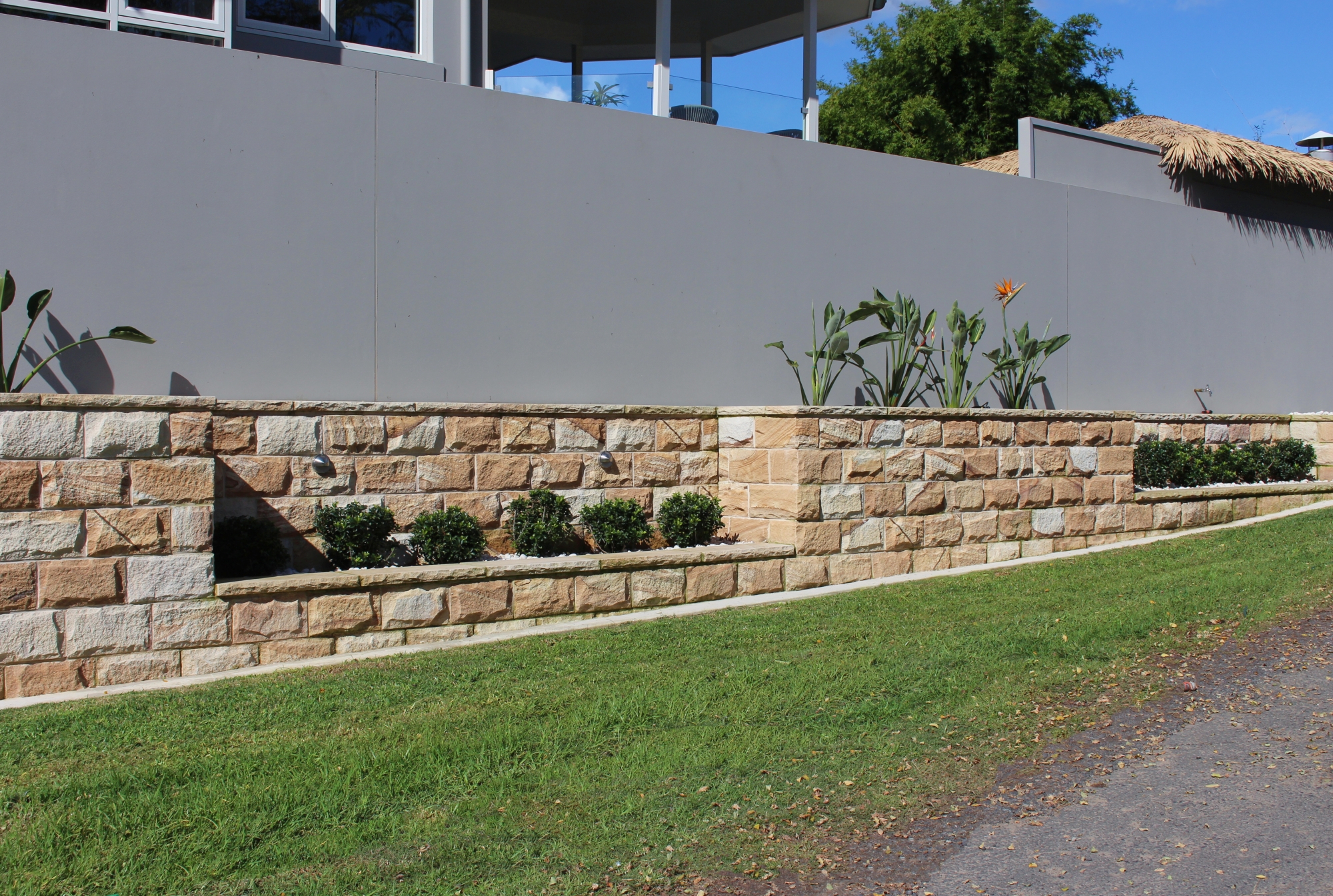 Rockfaced Banded sandstone cladding exterior wall detail