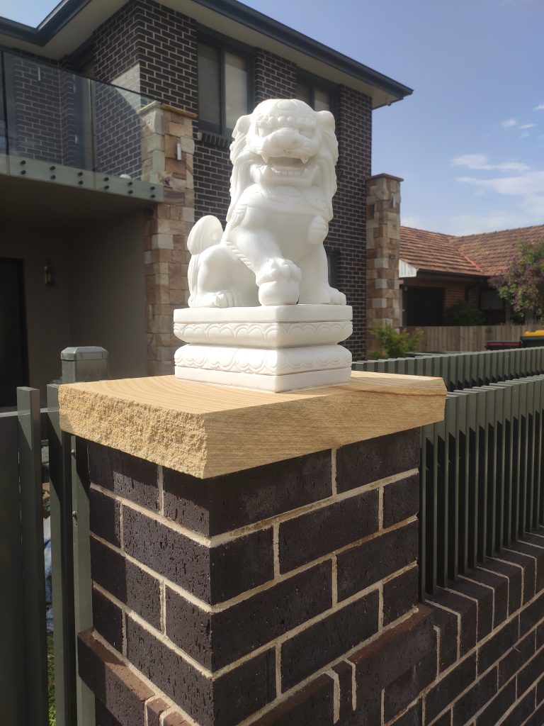 Colonial ranch walling with sandstone capping