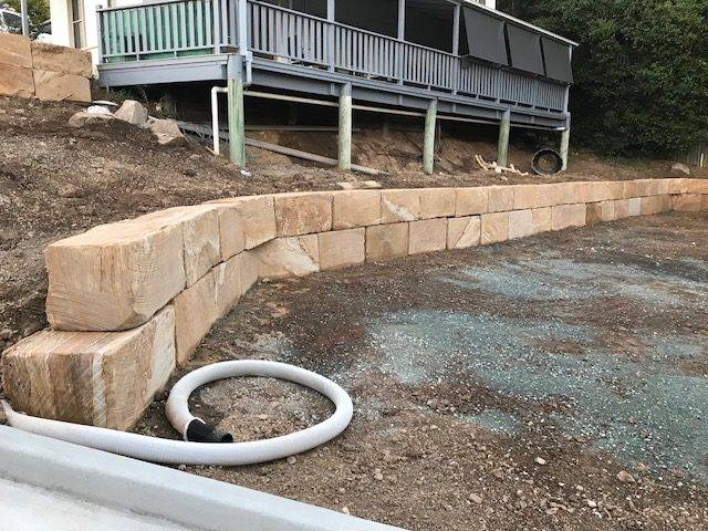 A Grade 5 sawn sided sandstone wall capping installation